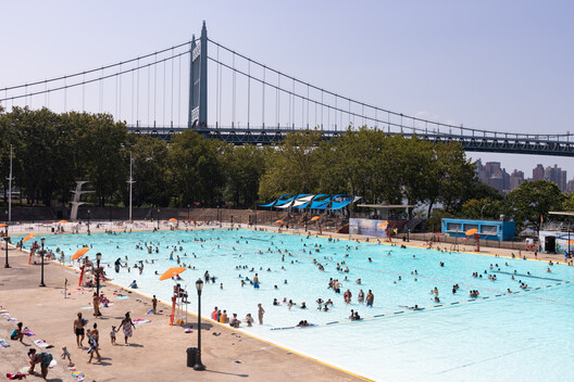 Astoria Queens, New York / USA - August 25 2020: Astoria Pool at Astoria Park during the Summer with People and the Triborough Bridge in the Background. Image © James Andrews1 via Shutterstock Astoria Queens, New York / USA - August 25 2020: Astoria Pool at Astoria Park during the Summer with People and the Triborough Bridge in the Background. Image © James Andrews1 via Shutterstock