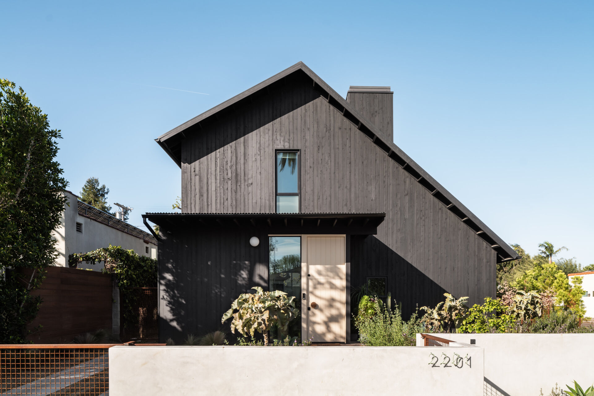 A Dark Exterior and Multi-Purpose ADU Shape This Modern Family Home